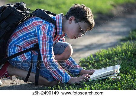 Russia. Belgorod region. Solomino village. The boy goes to the village school. View Large Photo Image Stock Photo - Russia. Belgorod region. Solomino village. The boy goes to the village school.. Fotosearch