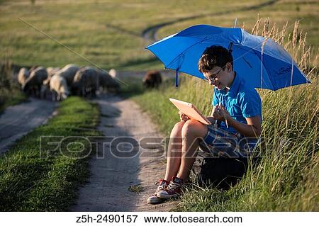 Stock Photo - Russia. Belgorod region. Solomino village. The boy goes to the village school.. Fotosearch