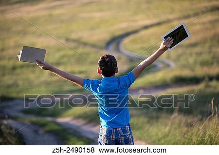 Stock Photo - Russia. Belgorod region. Solomino village. The boy goes to the village school.. Fotosearch