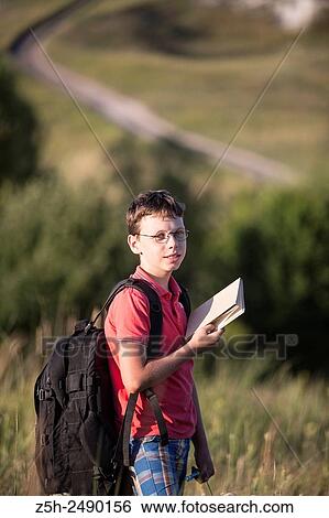 Stock Photograph - Russia. Belgorod region. Solomino village. The boy goes to the village school.. Fotosearch
