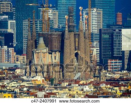 Sagrada Familia in foreground. Diagonal Mar buildings in background, Barcelona, Catalonia, Spain View Large Photo Image Stock Image - Sagrada Familia in foreground. Diagonal Mar buildings in background, Barcelona, Catalonia, Spain. Fotosearch