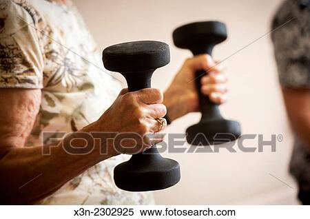 Senior woman with weights. View Large Photo Image Stock Photography - Senior woman with weights.. Fotosearch