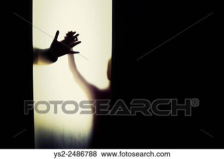 Stock Photo - Silhouette of child and adult holding hands. Conceptual image of trust, connection and bonding.. Fotosearch