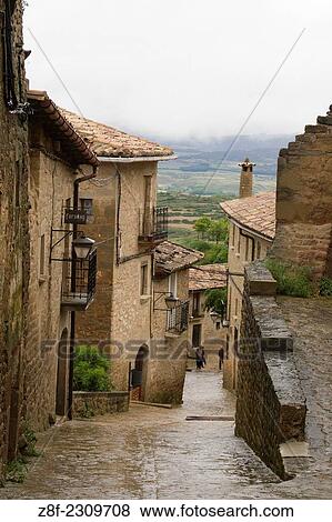 Steep and narrow streets lead uphill to the town center. View Large Photo Image Stock Photo - Steep and narrow streets lead uphill to the town center.. Fotosearch