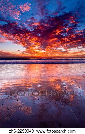 Stock Photo - Sunset over the Channel Islands from Ventura State Beach, Ventura, California USA.. Fotosearch