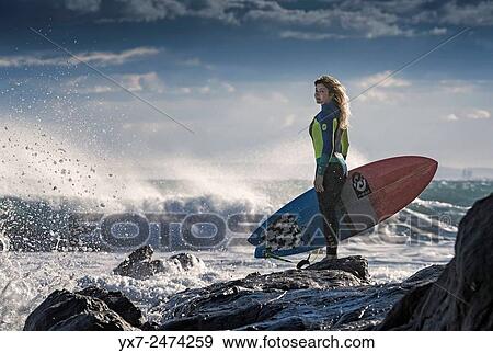 Stock Photo - Surfer looking at the ocean. Tarifa, Cadiz, Costa de la Luz, Andalusia, Spain.. Fotosearch