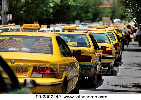 Stock Image - Taxis on the street in Shiraz, Iran, Asian.. Fotosearch