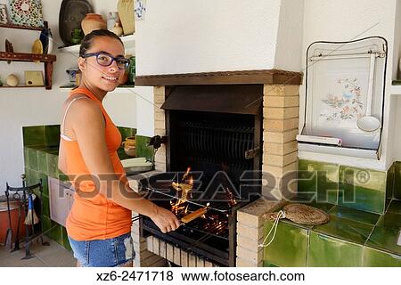 Teenage girl preparing a barbecue. View Large Photo Image Stock Photo - Teenage girl preparing a barbecue.. Fotosearch
