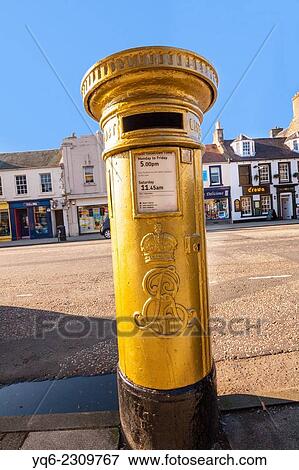 Stock Photo - The red post box in Scott Brash’s home town of Peebles was painted gold following his Olympic gold medal win in 2012.. Fotosearch