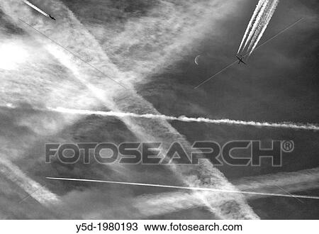 The sky filled with vapour trails of passenger jet liners View Large Photo Image Stock Image - The sky filled with vapour trails of passenger jet liners. Fotosearch