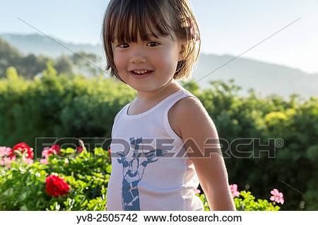 Three year old girl wearing a printed tank top, La Jolla, California. View Large Photo Image Stock Image - Three year old girl wearing a printed tank top, La Jolla, California.. Fotosearch
