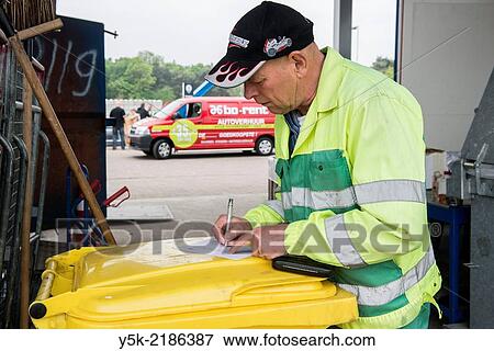 Tilburg, Netherlands. Male employee at Tilburg´s garbage company. View Large Photo Image Stock Photo - Tilburg, Netherlands. Male employee at Tilburg´s garbage company.. Fotosearch