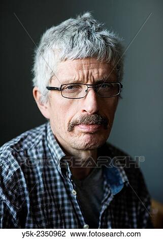 Tilburg, Netherlands. Studio portrait of a middle aged man wearing glasses and mustache. View Large Photo Image Stock Image - Tilburg, Netherlands. Studio portrait of a middle aged man wearing glasses and mustache.. Fotosearch
