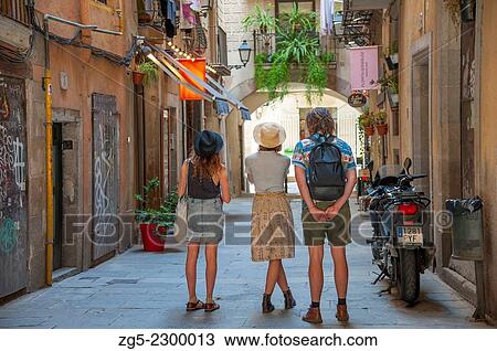 Tourists marvel at an alleyway in the Gothic Quarter of Barcelona, Catalonia, Spain. View Large Photo Image Stock Image - Tourists marvel at an alleyway in the Gothic Quarter of Barcelona, Catalonia, Spain.. Fotosearch