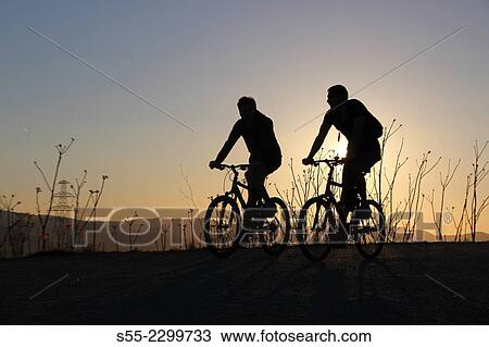 Two cyclists, Passeig de les Aigües; Collserola mountain, Barcelona, Catalonia, Spain. View Large Photo Image Stock Image - Two cyclists, Passeig de les Aigües; Collserola mountain, Barcelona, Catalonia, Spain.. Fotosearch