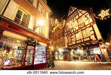 Typical timber-framing houses witn Christmas lights at the city center by night. Colmar. Wine route. Haut-Rhin. Alsace. France. View Large Photo Image Stock Image - Typical timber-framing houses witn Christmas lights at the city center by night. Colmar. Wine route. Haut-Rhin. Alsace. France.. Fotosearch