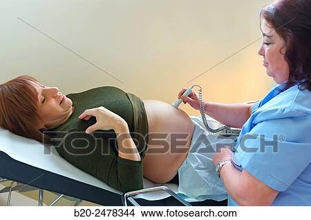 Ultrasound, Midwife examining pregnant, Medical consultation, Ambulatory Lezo, Gipuzkoa, Basque Country, Spain View Large Photo Image Picture - Ultrasound, Midwife examining pregnant, Medical consultation, Ambulatory Lezo, Gipuzkoa, Basque Country, Spain. Fotosearch