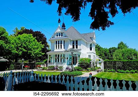 Stock Image - USA, Michigan, Lexington, White Victorian style home exterior (middle 1800s). Fotosearch