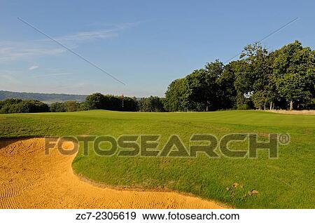 View of the 8th Green and Bunker and the North Downs Wrotham Heath Golf Club Sevenoaks Kent England. View Large Photo Image Stock Photo - View of the 8th Green and Bunker and the North Downs Wrotham Heath Golf Club Sevenoaks Kent England.. Fotosearch
