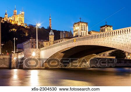 View of the Cathedral of St-Jean and the Bonaparte bridge in Lyon, Rhône, Rhône-Alpes, France. View Large Photo Image Stock Image - View of the Cathedral of St-Jean and the Bonaparte bridge in Lyon, Rhône, Rhône-Alpes, France.. Fotosearch