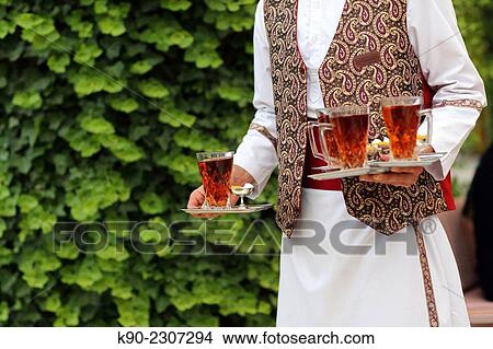Waiter carrying hot tea, Abbasi Hotel, Esfahan, Iran, Asian. View Large Photo Image Picture - Waiter carrying hot tea, Abbasi Hotel, Esfahan, Iran, Asian.. Fotosearch
