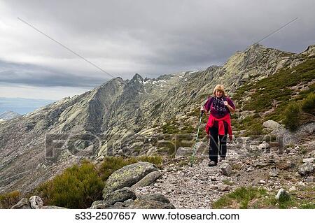 Walking on Peon pass road in the Sierra de Gredos. Avila. Castilla Leon. Spain. Europe. View Large Photo Image Stock Photo - Walking on Peon pass road in the Sierra de Gredos. Avila. Castilla Leon. Spain. Europe.. Fotosearch