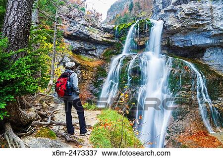 Stock Photo - Waterfall in Estrecho cave. Ordesa Valley. Ordesa National Park. Pyrenees, Huesca, Spain, Europe.. Fotosearch