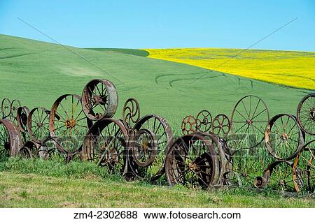 Wheel fence at the Dahmen Barn (Art Barn) in Whitman County in the Palouse near Pullman, Washington State, USA. View Large Photo Image Stock Photo - Wheel fence at the Dahmen Barn (Art Barn) in Whitman County in the Palouse near Pullman, Washington State, USA.. Fotosearch
