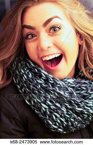 Stock Photography - woman, 19, smiling in surprise. Fotosearch