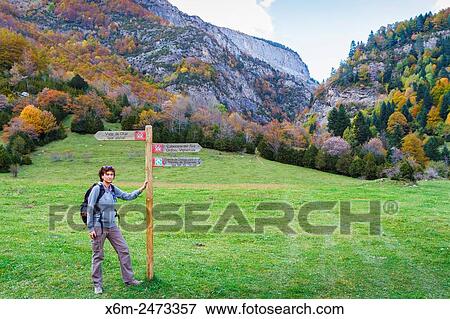 Stock Photo - Woman and signal. Bujaruelo Valley. Pyrenees, Huesca, Spain, Europe.. Fotosearch