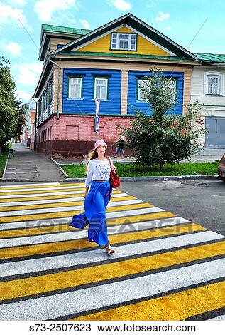 Woman crossing road and 19 century house, Kazan, Tatarstan, Russia View Large Photo Image Stock Image - Woman crossing road and 19 century house, Kazan, Tatarstan, Russia. Fotosearch