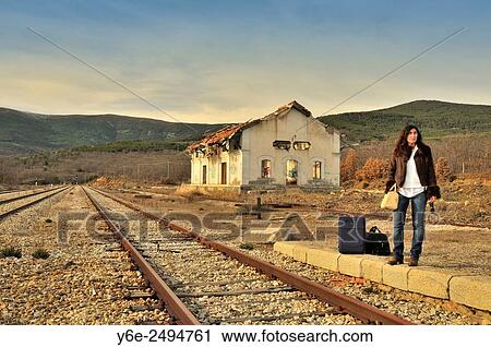 Woman in railway station. Buitrago de Lozoya, Madrid province, Spain View Large Photo Image Stock Image - Woman in railway station. Buitrago de Lozoya, Madrid province, Spain. Fotosearch