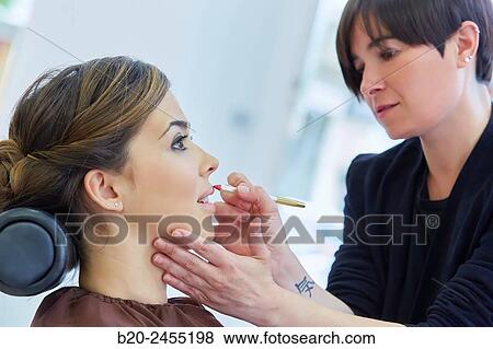 Woman. Makeup artist applying lip liner. Hairdressing salon and Beauty Clinic. View Large Photo Image Stock Photo - Woman. Makeup artist applying lip liner. Hairdressing salon and Beauty Clinic.. Fotosearch