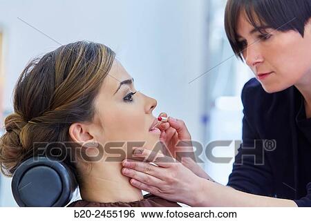 Woman. Makeup artist applying lip liner. Hairdressing salon and Beauty Clinic. View Large Photo Image Stock Photograph - Woman. Makeup artist applying lip liner. Hairdressing salon and Beauty Clinic.. Fotosearch