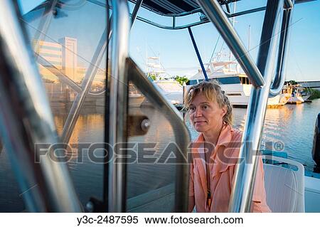 Woman opearting boat, Marina in Nuevo Vallarta, Mexico. View Large Photo Image Stock Photography - Woman opearting boat, Marina in Nuevo Vallarta, Mexico.. Fotosearch