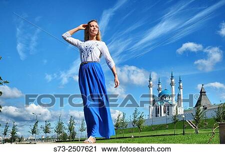 Stock Image - Woman poses in Kul Sharif mosque in Kazan Kremlin, Russia. Fotosearch