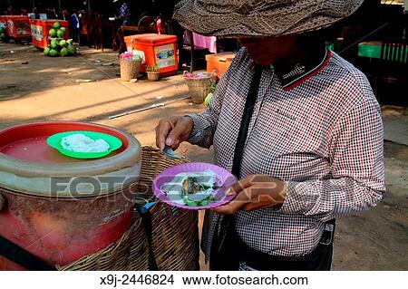 Picture - Woman selling exotic products, Siem Reap, Cambodia. Fotosearch