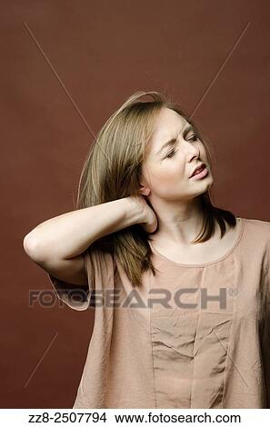 Woman with pain in the neck. View Large Photo Image Picture - Woman with pain in the neck.. Fotosearch