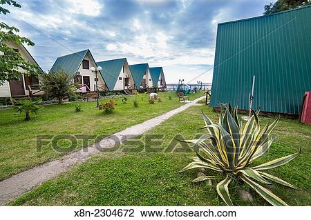 Wooden cottages, Black sea shore, Abkhazia. View Large Photo Image Stock Image - Wooden cottages, Black sea shore, Abkhazia.. Fotosearch