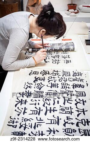 Stock Photo - Writing Chinese characters, Valencia, Spain. Fotosearch