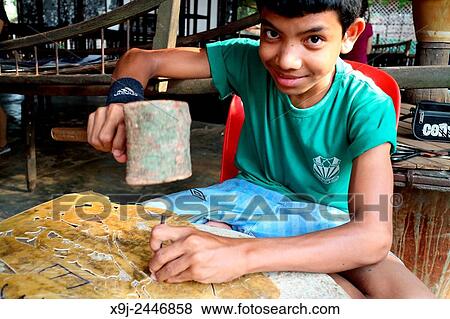 Young Cambodian student learning the art of leather craftsmanship, Siem Reap, Cambodia View Large Photo Image Stock Photo - Young Cambodian student learning the art of leather craftsmanship, Siem Reap, Cambodia. Fotosearch