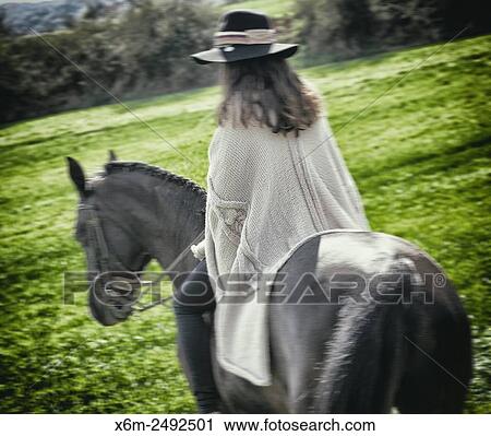Stock Image - Young girl and horse. Ayegui, Navarre, Spain.. Fotosearch