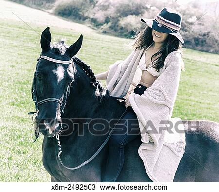 Stock Image - Young girl and horse. Ayegui, Navarre, Spain.. Fotosearch