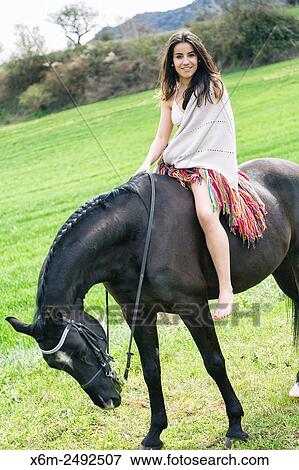 Stock Photo - Young girl and horse. Ayegui, Navarre, Spain.. Fotosearch