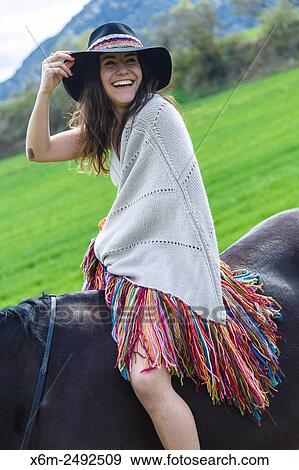 Stock Photo - Young girl and horse. Ayegui, Navarre, Spain.. Fotosearch