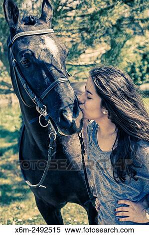 Stock Photography - Young girl and horse. Ayegui, Navarre, Spain.. Fotosearch