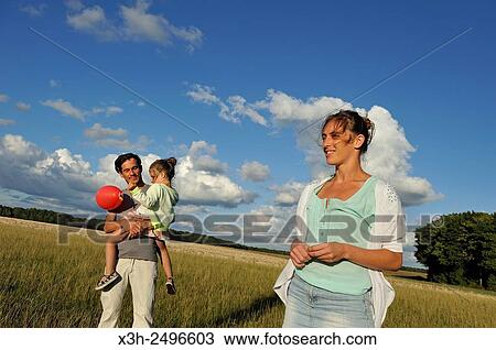 young parents with their little daughter, Ile-de-France, France, Europe. View Large Photo Image Stock Image - young parents with their little daughter, Ile-de-France, France, Europe.. Fotosearch