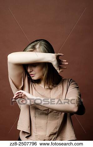 Young woman in danger haiding face with hands. View Large Photo Image Stock Photograph - Young woman in danger haiding face with hands.. Fotosearch