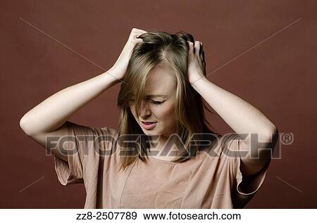 Young woman scratching itchy scalp. View Large Photo Image Stock Photo - Young woman scratching itchy scalp.. Fotosearch