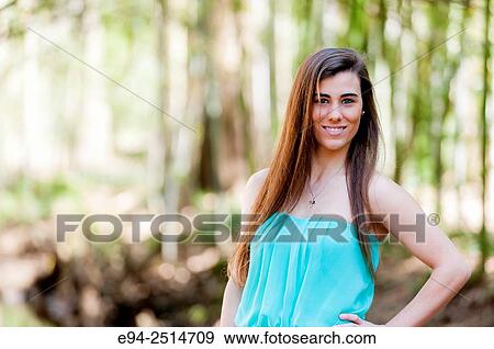 A smiling 22 year old woman outdoors dressed in a mini-skirt and heels. View Large Photo Image Stock Photo - A smiling 22 year old woman outdoors dressed in a mini-skirt and heels.. Fotosearch